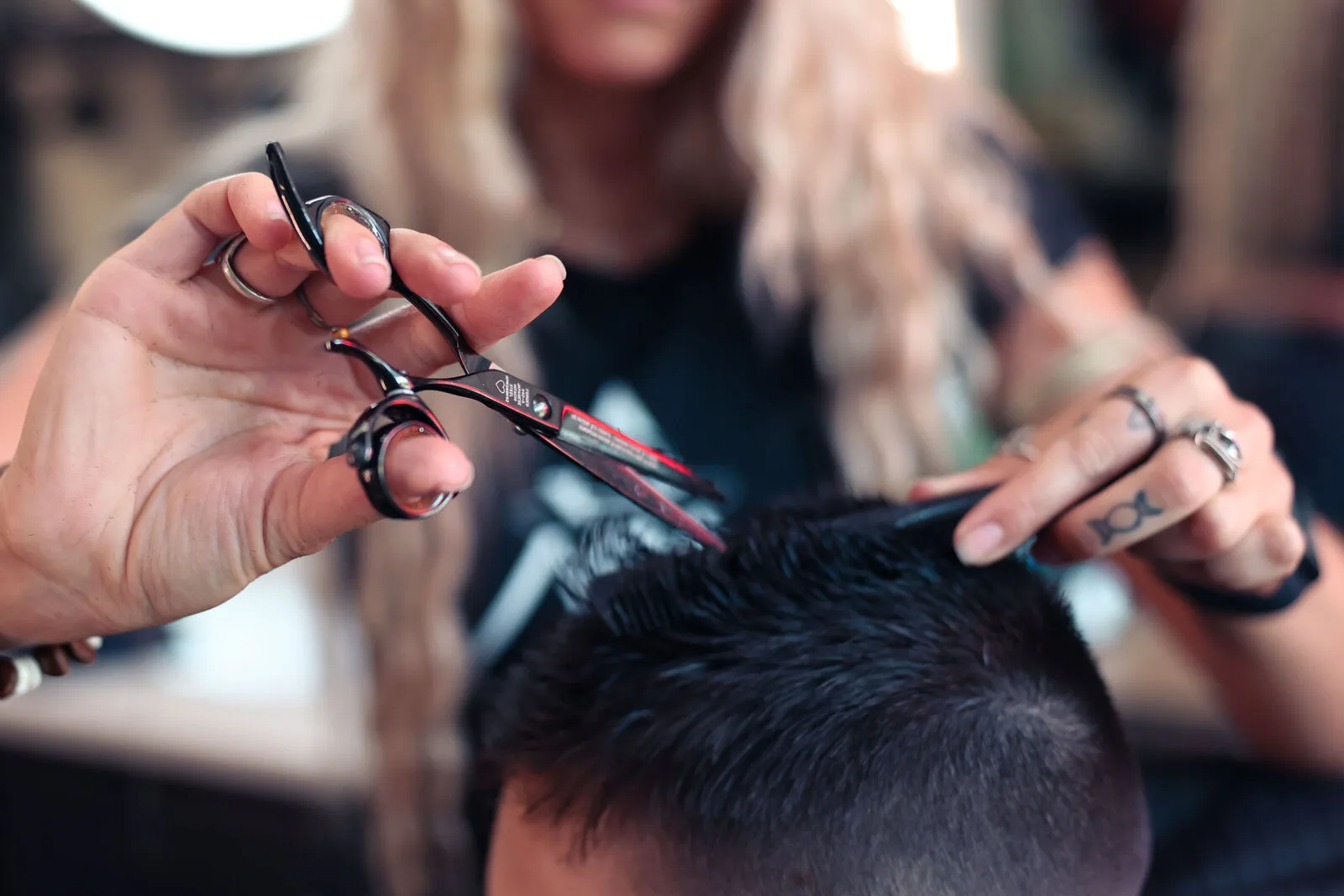 Master barber Ren Faith working on a client at Black Hat Barber, downtown Willoughby Ohio