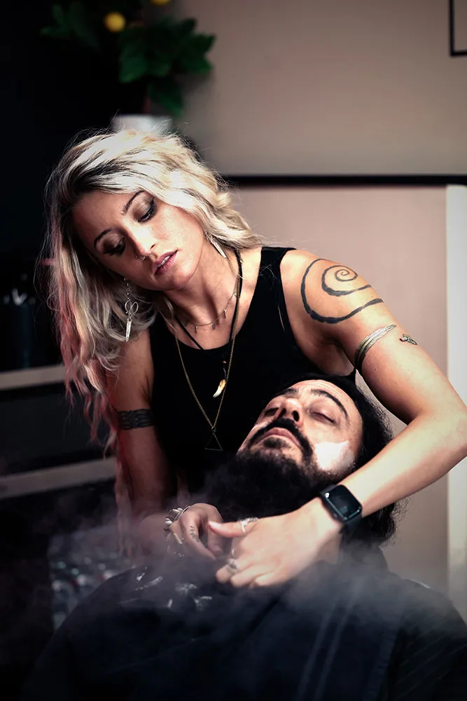 Ren Faith performing a precision fade haircut at Black Hat Barber in Willoughby, Ohio