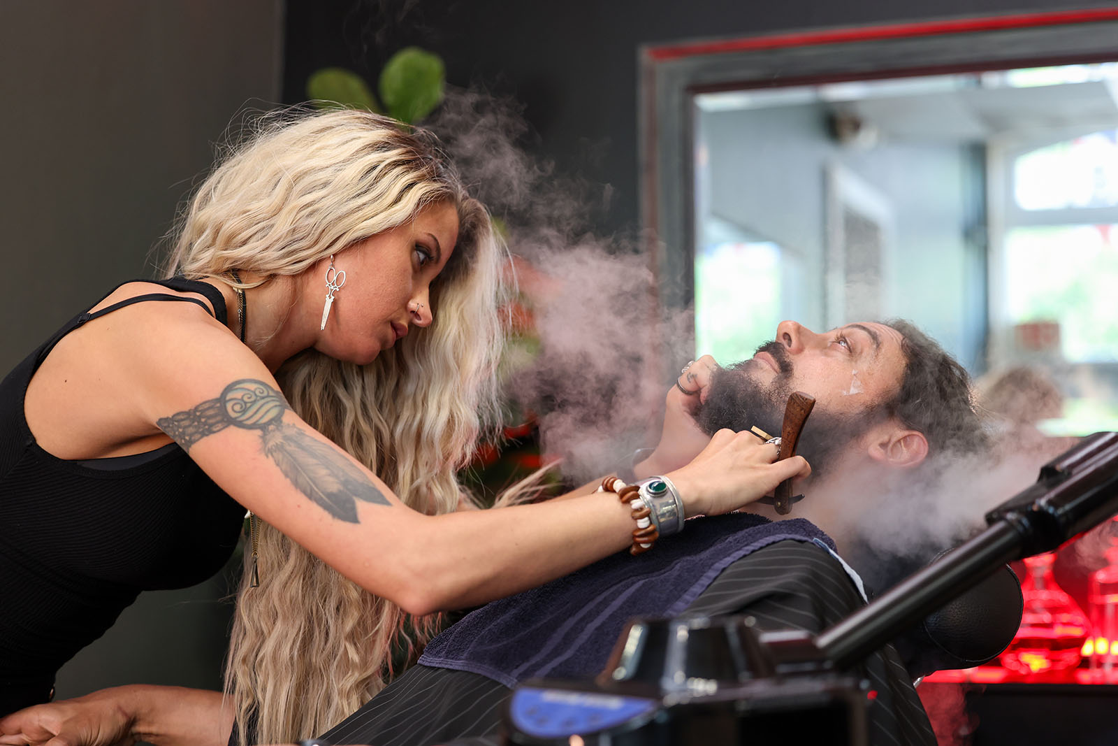 Master barber Ren Faith mid-cut at Black Hat Barber, downtown Willoughby, Ohio