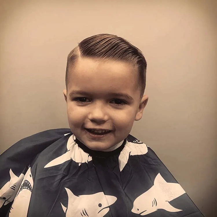 Tapered men's haircut with hard part at Black Hat Barber, downtown Willoughby OH
