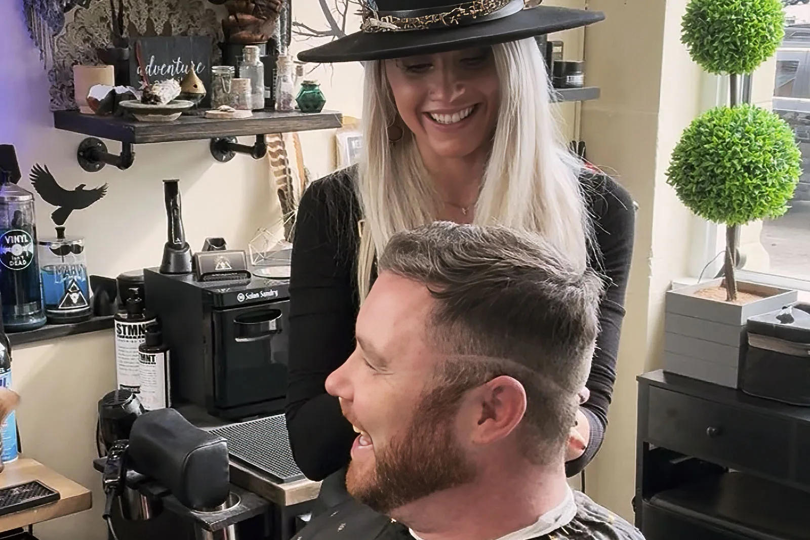 Master barber Ren Faith and a client choosing fade height at Black Hat Barber, downtown Willoughby Ohio