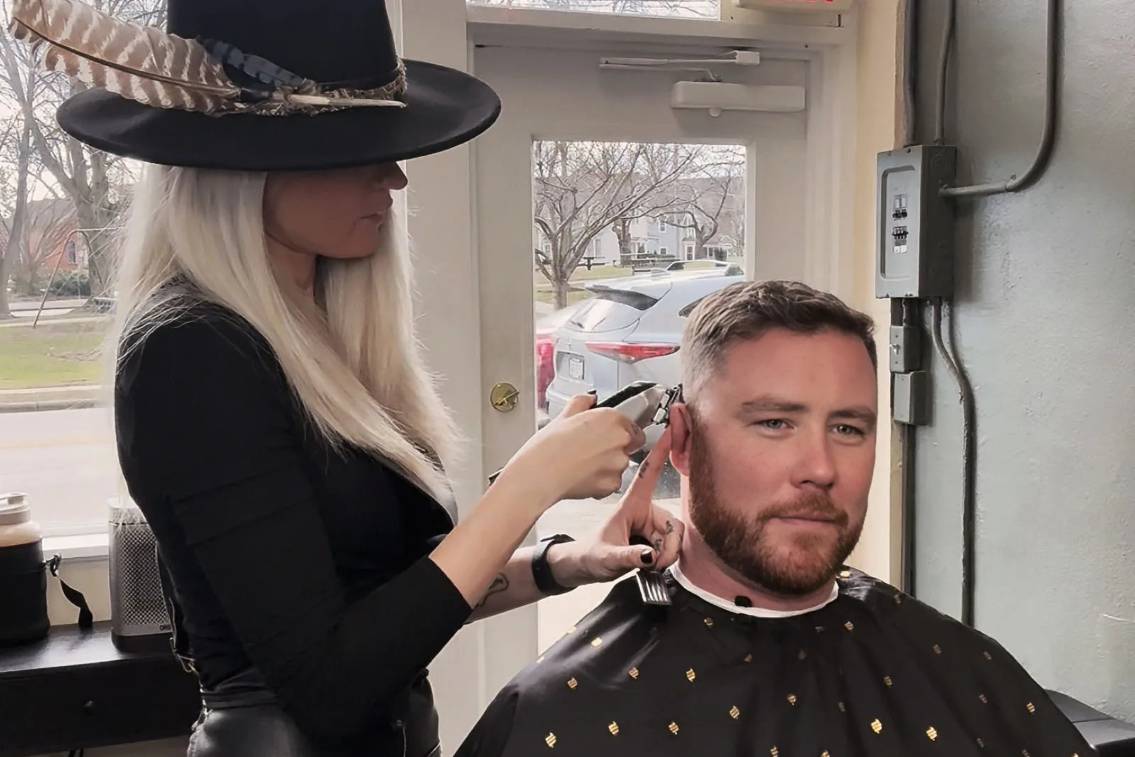 Blending the transition zone of a fade haircut at Black Hat Barber, Willoughby Ohio