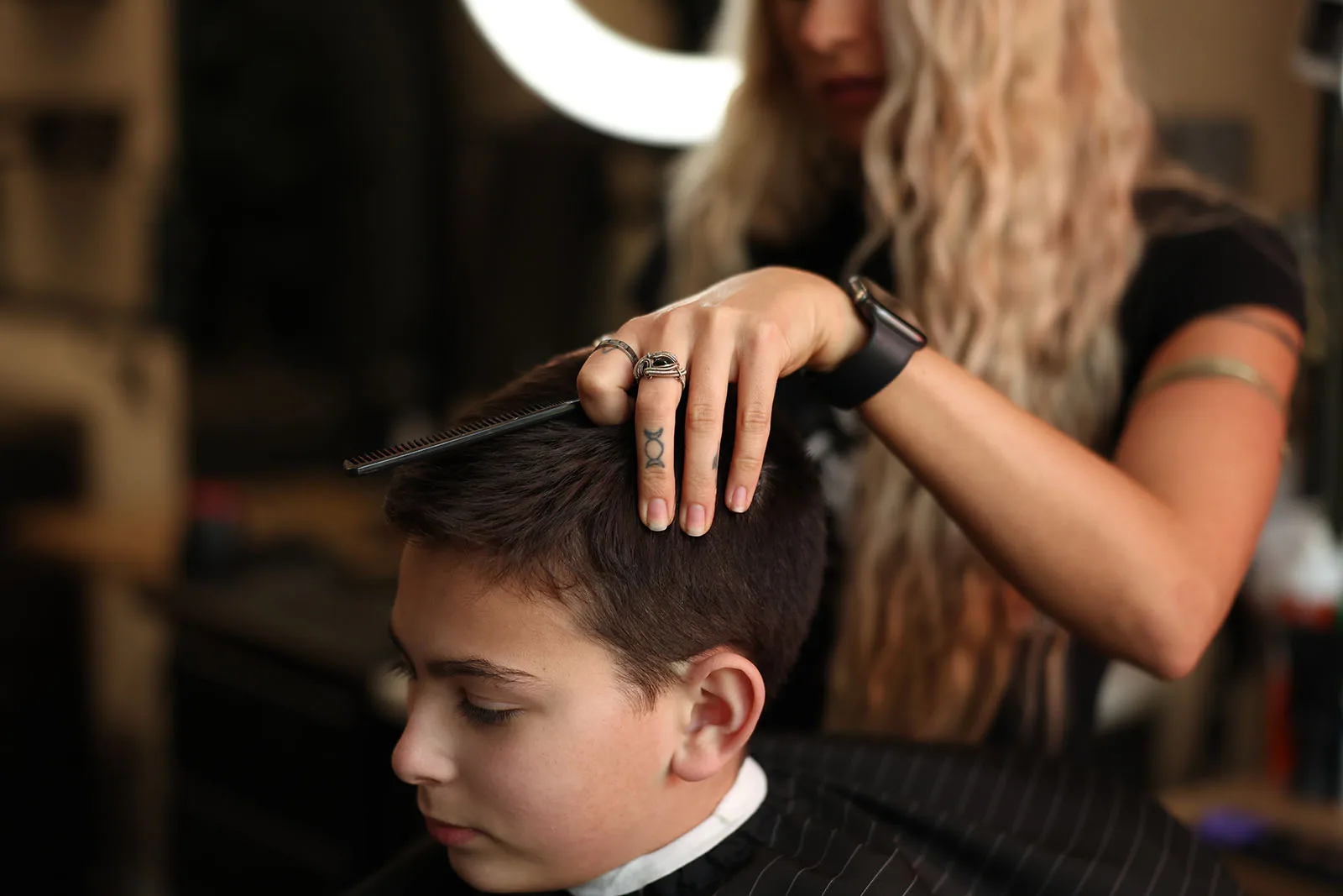 Kids haircut in progress at Black Hat Barber, master barber work for boys in downtown Willoughby Ohio